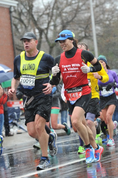 Vincent Hau guiding Richard Hunter as they run the Boston Marathon