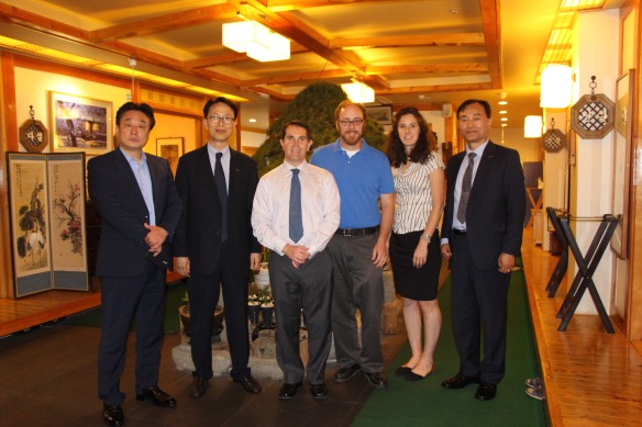Kyle and Andrea pose for a photo at dinner with their fellow presenters and 3 representatives from K-Sports Foundation